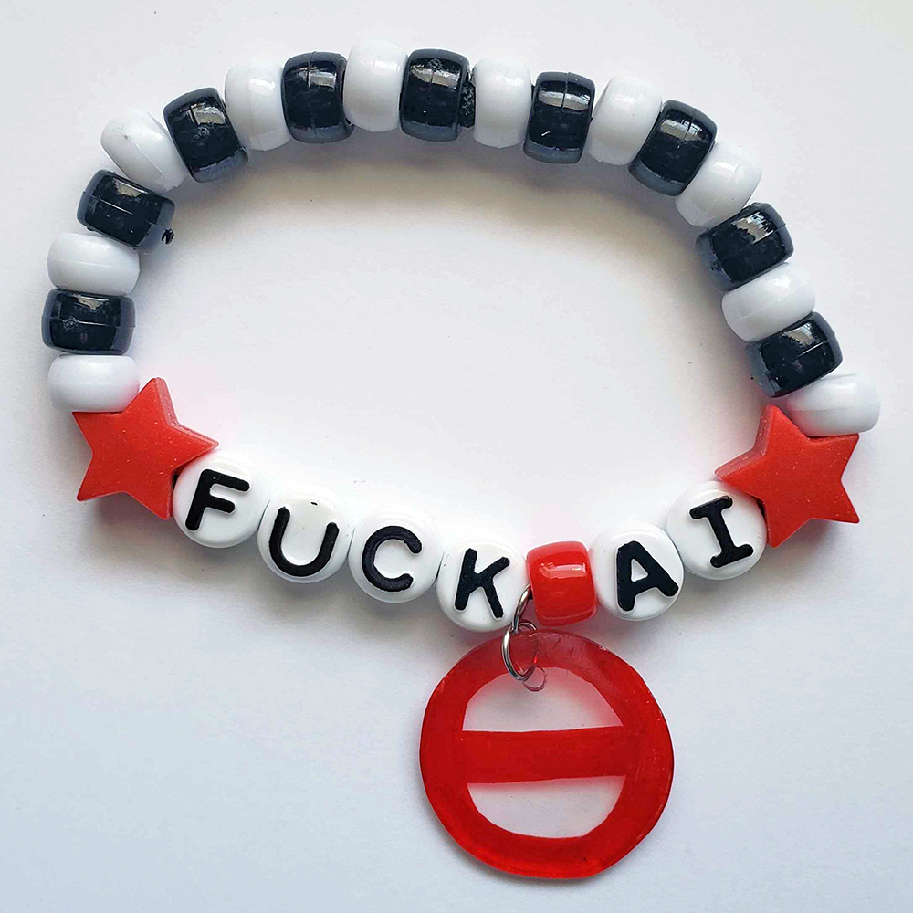 a black and white plastic-beaded bracelet with red stars and a red crossed out circle charm, that states plainly 'FUCK AI.'