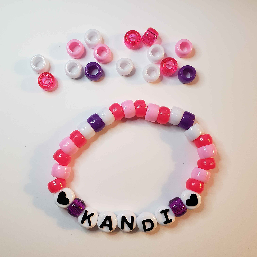 a chunky plastic-beaded bracelet themed after another player's original character