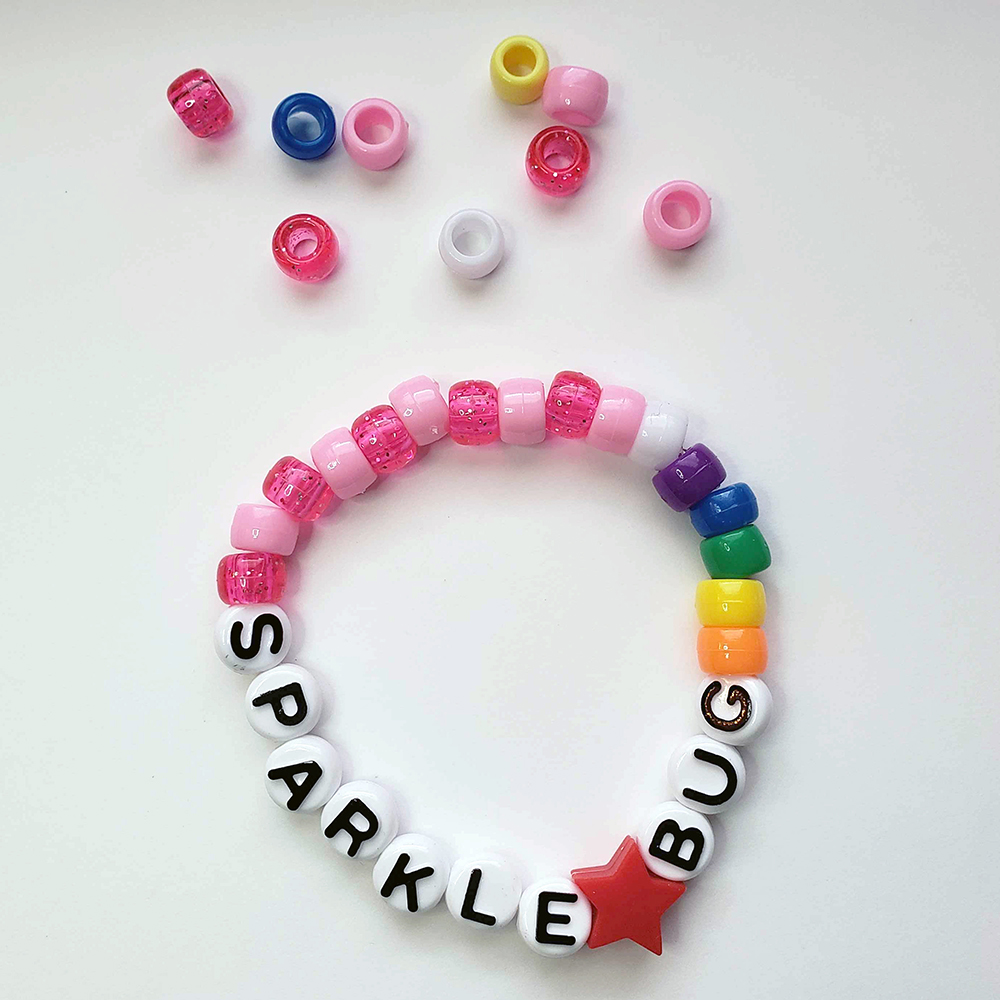 a chunky plastic-beaded bracelet themed after another player's original character