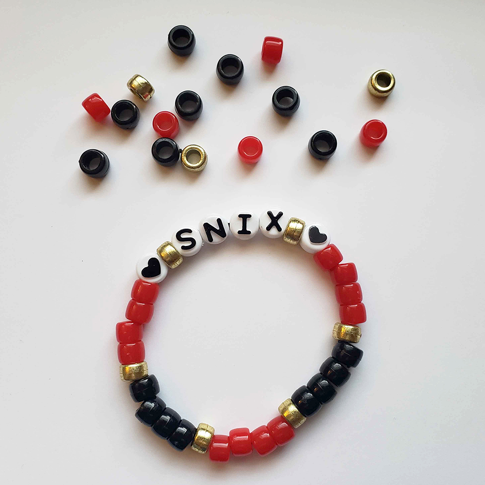 a chunky plastic-beaded bracelet themed after another player's original character