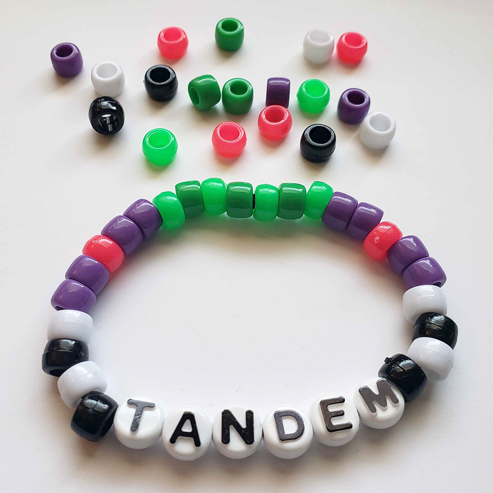 a chunky plastic-beaded bracelet themed after another player's original character