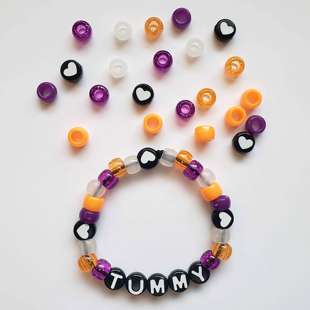 a chunky plastic-beaded bracelet themed after another player's original character