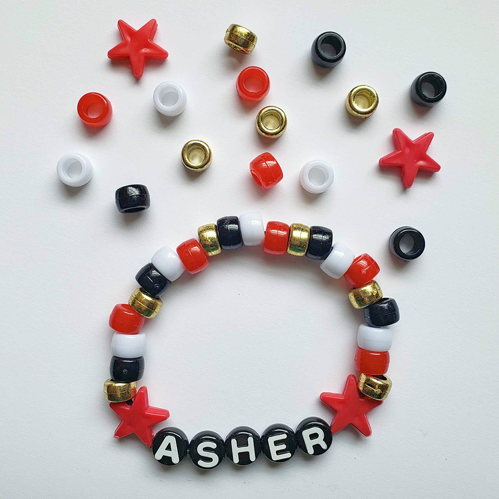 a chunky plastic-beaded bracelet themed after another player's original character