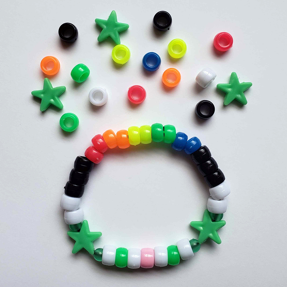 a chunky plastic-beaded bracelet themed after another player's original character