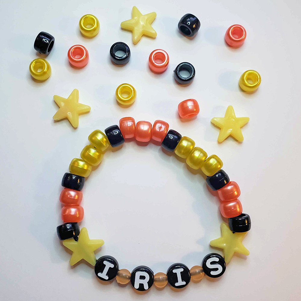 a chunky plastic-beaded bracelet themed after another player's original character