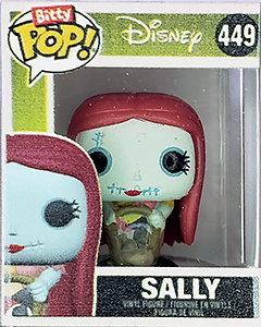 a miniature plastic 'Funko Pops' box with a tiny figure of Sally the rag doll from The Nightmare Before Christmas