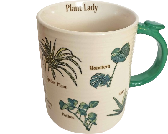 a white, lightly ridged mug with a green handle (featuring a small 'leaf'); the mug has various labeled plants printed on the outside, and the inside lip reads 'Plant Lady.'