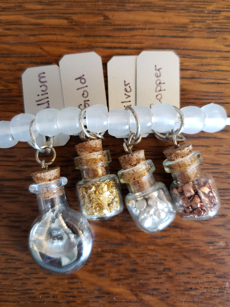 several vials with samples of different metals inside