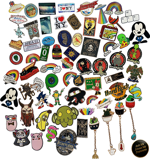 a collection of enamel pins on a hanging banner
