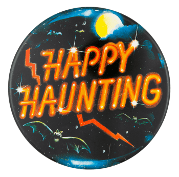 a pinback button that says 'happy haunting'