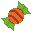 a piece of wrapped candy in orange and green
