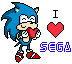 a small Sonic the Hedgehog holding a little valentine-style heart, next to the words 'I ♥️ Sega'