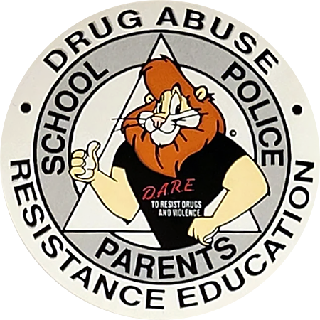A D.A.R.E. sticker featuring a lion wearing the program's shirt, surrounded by text that says 'School, Police, Parents, Drug Abuse Resistance Education