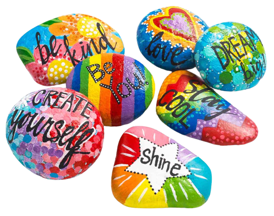 large river stones painted with bright colors and positive messages