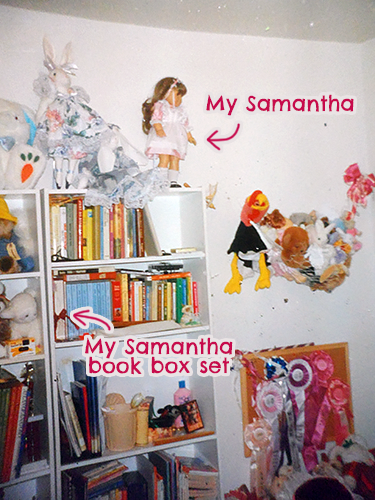 one wall of a child's bedroom, displaying books, toys, and ribbons from various extracurricular endeavors; featured are a Samantha doll in a pink dress, and a boxset of books tied closed with a ribbon